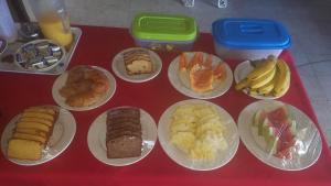 a table with plates of different types of food at Le Mirage in Negril