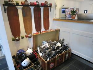 a room with a bunch of skis and helmets at City Backpackers Hostel in Stockholm