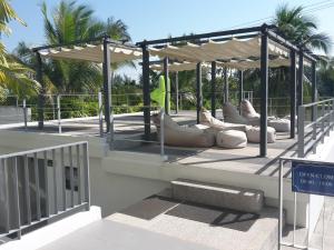 a pavilion with a bunch of chairs and a sign at The Sea Condominium 267/50 in Sam Roi Yot