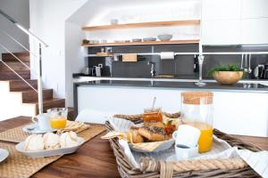 a table with a basket of food on it in a kitchen at Sunrise Chalet Casilla de Costa in La Oliva