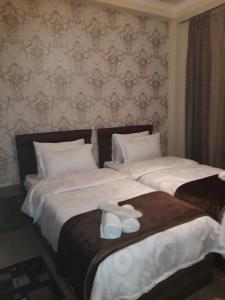 Rúm í herbergi á Hotel IVERIA