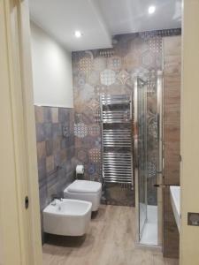 a bathroom with a toilet and a shower at Ponte Vestilli B&B in Limatola +31 photos
