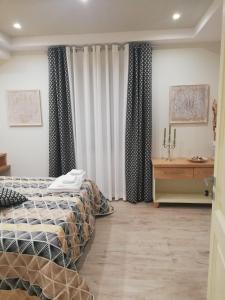 A bed or beds in a room at Ponte Vestilli B&B