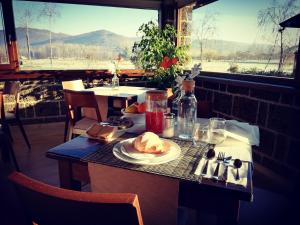 a table with a plate of food on top of it at Ponte Vestilli B&B in Limatola