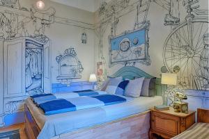 a bed room with a painting on the wall at Lavender Circus Hostel, Doubles & Ensuites in Budapest