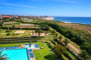 a view of a park with a swimming pool and the beach at Hotel Solverde Spa and Wellness Center in Vila Nova de Gaia