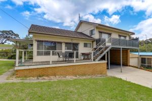 a house with a deck and a patio at Stradbroke in Metung