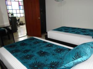 Voodi või voodid majutusasutuse Hotel Colonial toas