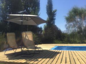 Der Swimmingpool an oder in der Nähe von Cabañas de Campo Colbún