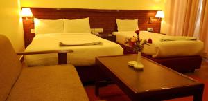 Ліжко або ліжка в номері Hotel The White Lotus View Pvt Ltd