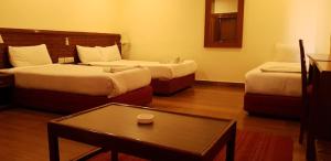 Ліжко або ліжка в номері Hotel The White Lotus View Pvt Ltd