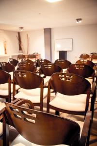 a room filled with lots of wooden chairs at Del Fundador in Córdoba +33 photos