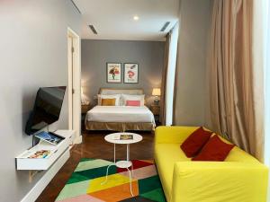 A bed or beds in a room at White Tree Residence