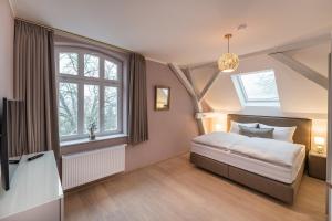 Postel nebo postele na pokoji v ubytování Villa von Boyneburgk