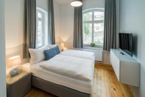 Postel nebo postele na pokoji v ubytování Villa von Boyneburgk