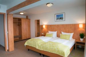 Postel nebo postele na pokoji v ubytování Hotel Mingarden + 36 fotografií