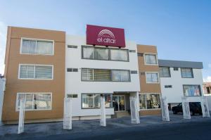a building with a sign on the front of it at Hotel El Altar in Riobamba