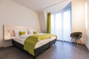 Postel nebo postele na pokoji v ubytování Hotel & Restaurant Michaelis