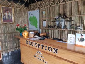 a reception area of a resort with a reception desk at Namthip Homebeach in Baan Tai