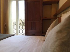 Säng eller sängar i ett rum på Albergo Ristorante Leso