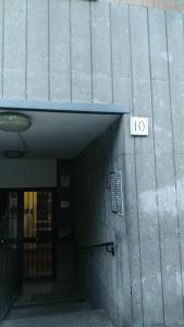 a door to a building with a sign on it at Valle Aurelia House in Rome