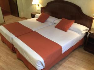 Postel nebo postele na pokoji v ubytování Hotel Cordón