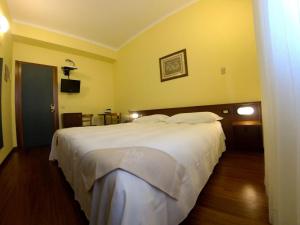 Postel nebo postele na pokoji v ubytování Hotel Mariani