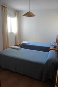Postel nebo postele na pokoji v ubytování APARTAMENTOS ALBANTA