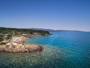 an aerial view of a beach in the water at Krk Premium Camping Resort by Valamar in Krk