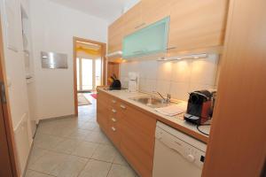 a kitchen with a sink and a counter at Casa-Gorma at the beach, Apartment 121 in Zavala