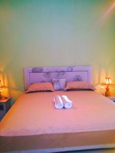 Postel nebo postele na pokoji v ubytování Three V Homestay