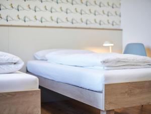 Postel nebo postele na pokoji v ubytování Radhotel am Gleis
