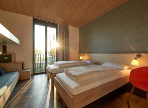 Postel nebo postele na pokoji v ubytování Radhotel am Gleis