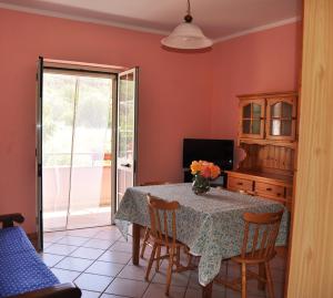 a dining room with a table and chairs at Casa Vacanze Marcella in Palinuro +55 photos