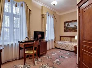 Posteľ alebo postele v izbe v ubytovaní Hotel Koronny