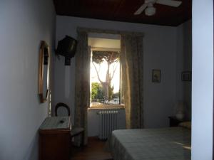 Postel nebo postele na pokoji v ubytování Albergo Lucia Pagnanelli