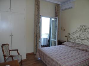 Postel nebo postele na pokoji v ubytování Albergo Lucia Pagnanelli
