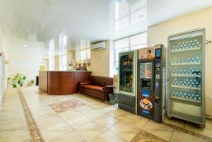 a room with a vending machine and a couch at Mon Plaisir in Kazan