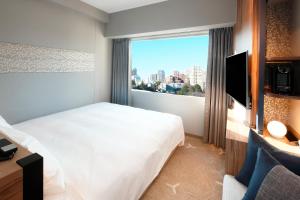Voodi või voodid majutusasutuse Miyako City Tokyo Takanawa toas