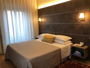 Postel nebo postele na pokoji v ubytování Hotel La Nuova Rotaia