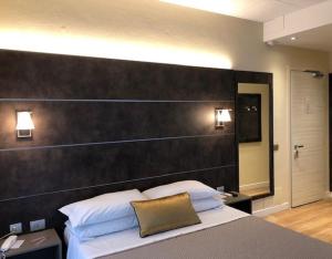 Postel nebo postele na pokoji v ubytování Hotel La Nuova Rotaia