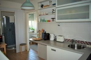 A kitchen or kitchenette at Gellért Hill Apartment