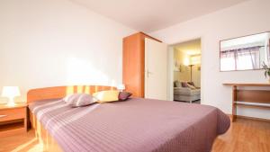 Postel nebo postele na pokoji v ubytování Apartment Medulin