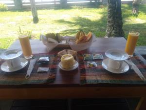 a table with a plate of food and a bowl of fruit at LE TRANSAT in Ambatoloaka +21 photos