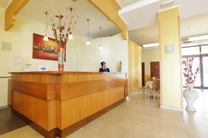 a large room with a large counter and a large window at Hotel Lido Degli Angeli in Licata