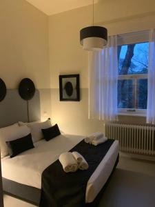 Ліжко або ліжка в номері Villa Gotti Charming Rooms