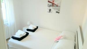 Posteľ alebo postele v izbe v ubytovaní Apartman Brankica