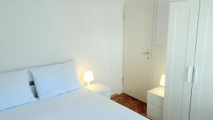 Posteľ alebo postele v izbe v ubytovaní Apartman Brankica