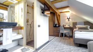 Postel nebo postele na pokoji v ubytování Michaelson Boutique Hotel & SPA Brícoła
