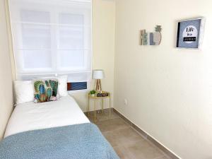 Postel nebo postele na pokoji v ubytování Cosy Flats Alicante